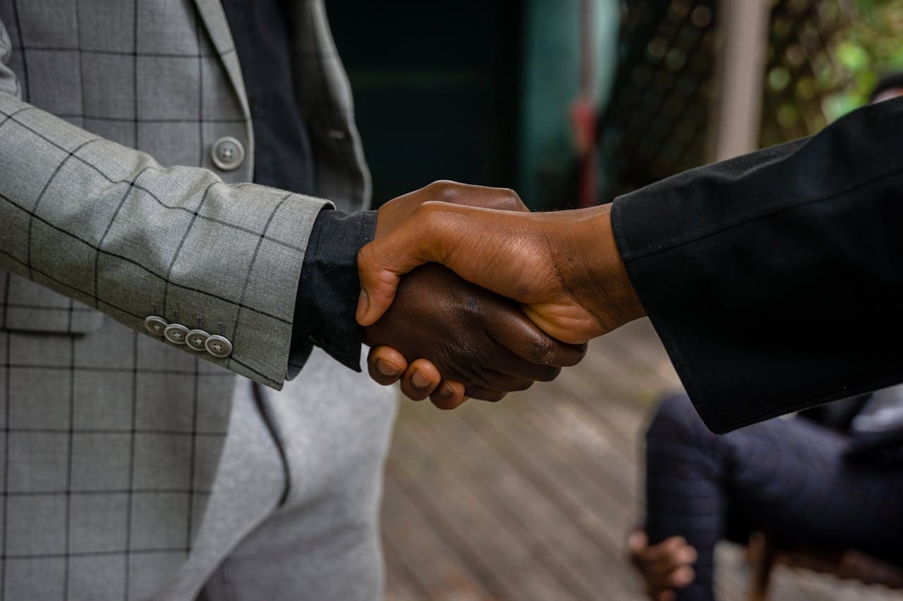 Two men shaking hands.